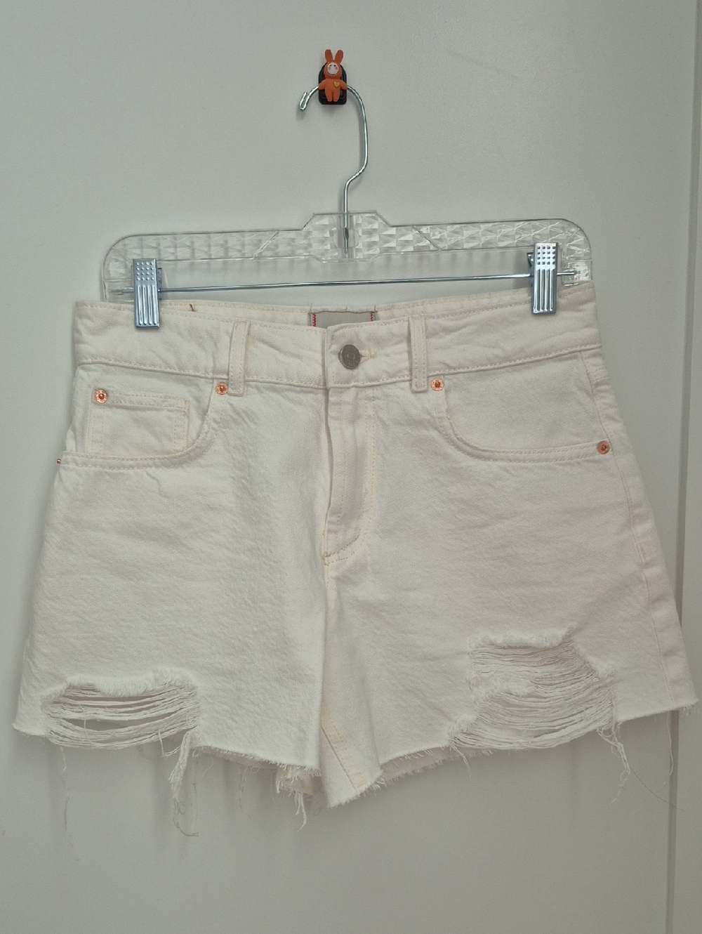 BDG Women’s Cream Distressed Denim Shorts